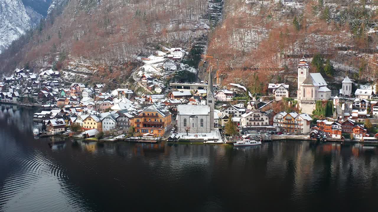 Aerial establishing shot of beautiful Hallstatt town in the winter, Orbit shot