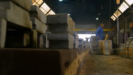 worker operating crane in foundry workshop 4k