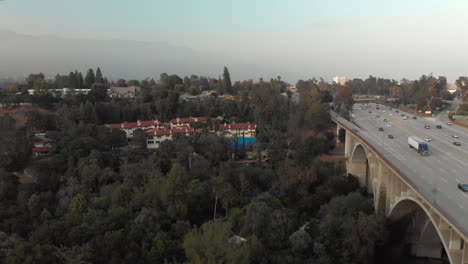 aerial view of highway traffic with surrounding landscape