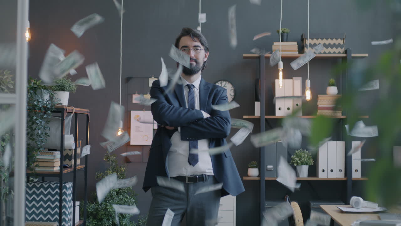 Businessman in Office with Money Falling