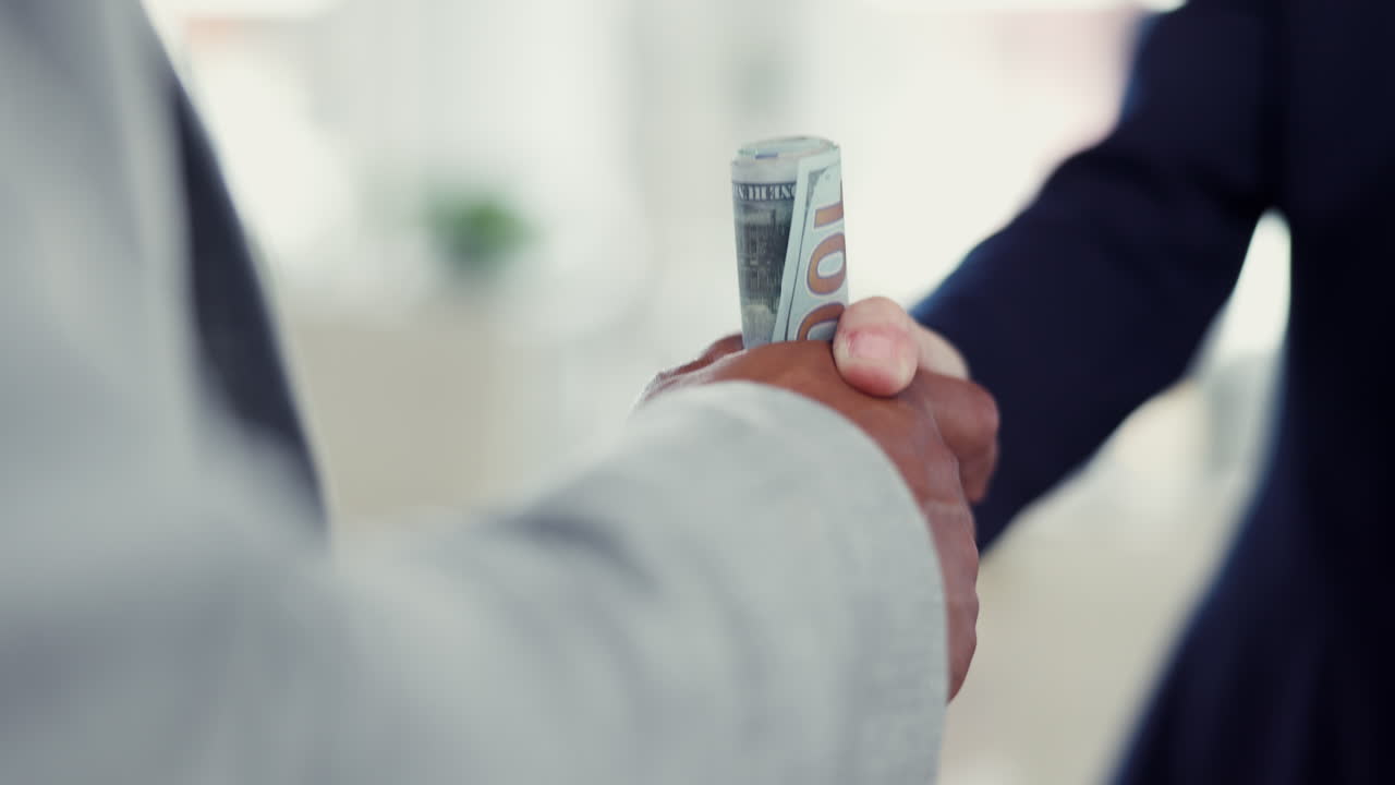 Business, money and handshake with bribe