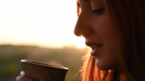 a thoughtful moment at sunset: a young woman enjoys a warm drink, lost in contemplation while the sun casts a golden glow, creating a serene atmosphere of peace and reflection