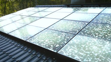 solar power modules absorbing sunlight on top of a house, sunny day