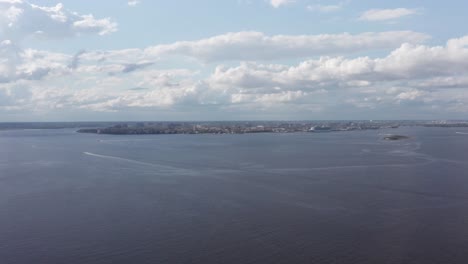 Super-wide-aerial-shot-of-the-Charleston-skyline-and-harbor-from-the-perspective-of-Fort-Johnson-off-James-Island,-South-Carolina