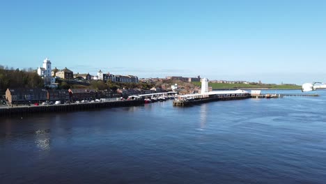 view of the rivershore as seen from the ferry leaving newcastle upon tyne, england