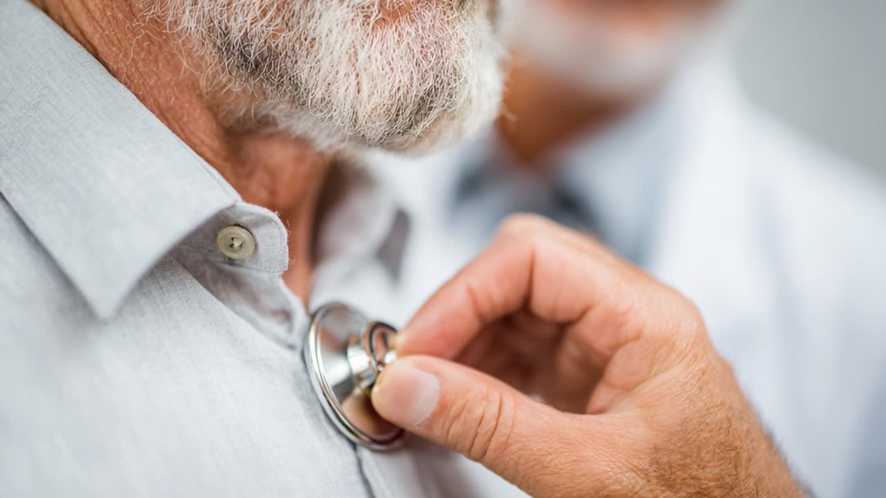 A healthcare professional conducts a routine examination, using a stethoscope to check the heart and lungs of an elderly male patient, emphasizing the importance of regular health check-ups