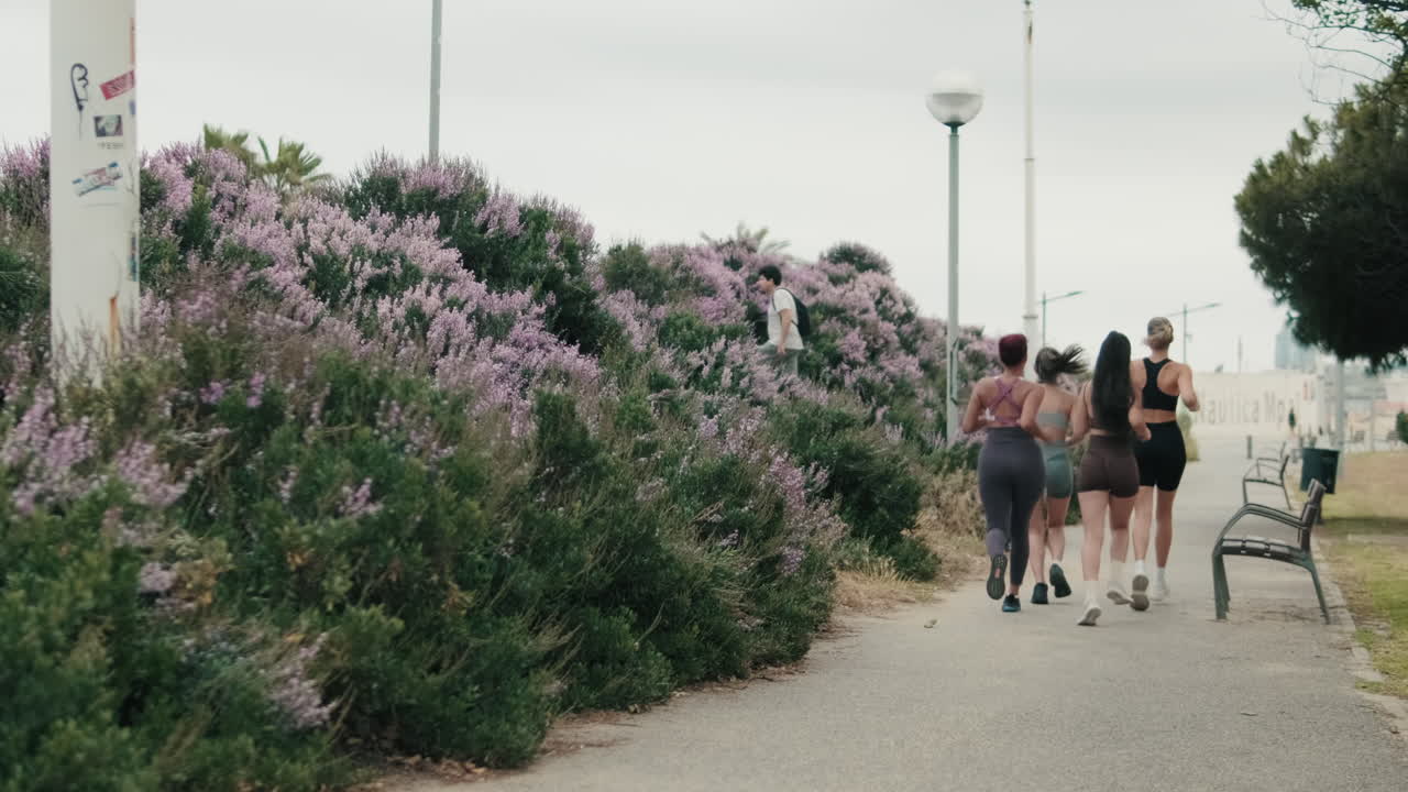 Friends Jogging in a City Park