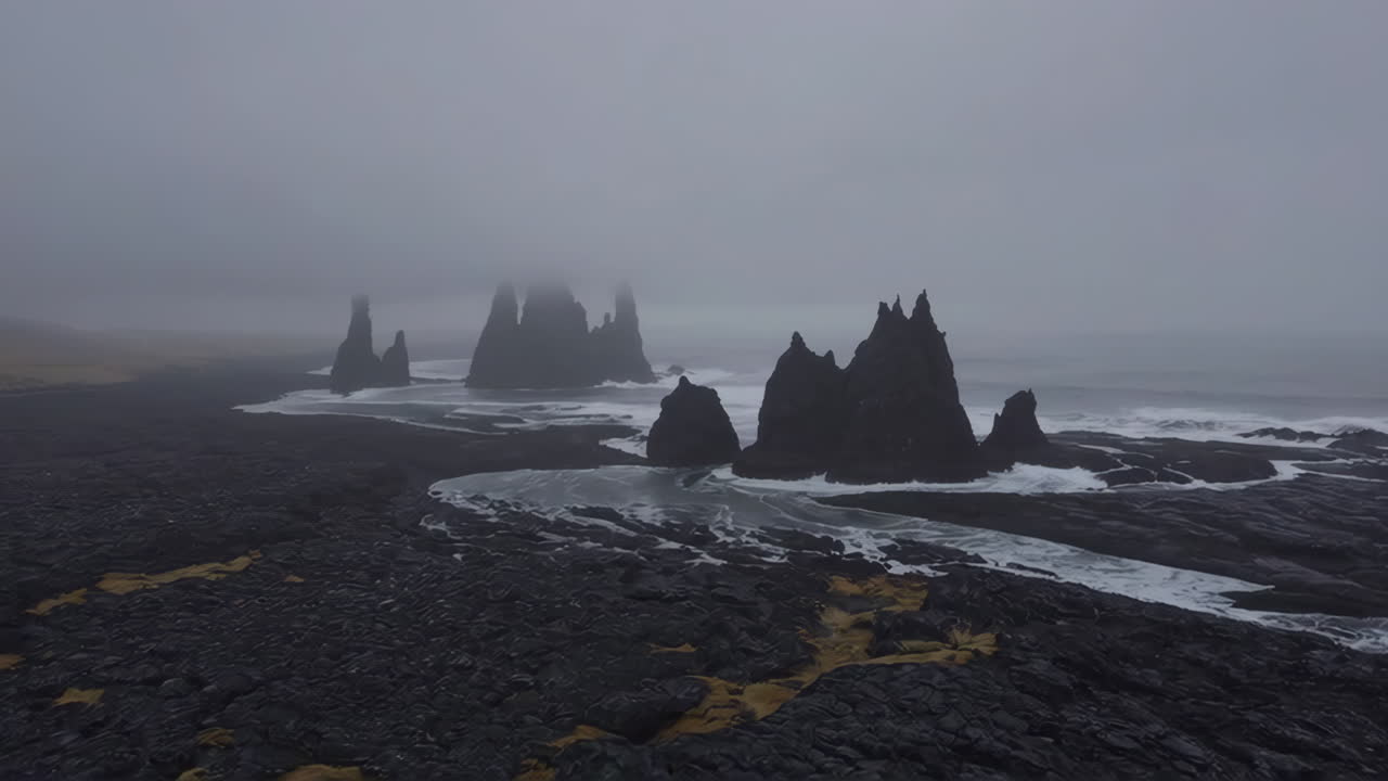 Dramatic Sea Stacks on a Misty Volcanic Coast