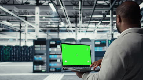 vertical video data center admin using isolated screen laptop to monitor neural network ai