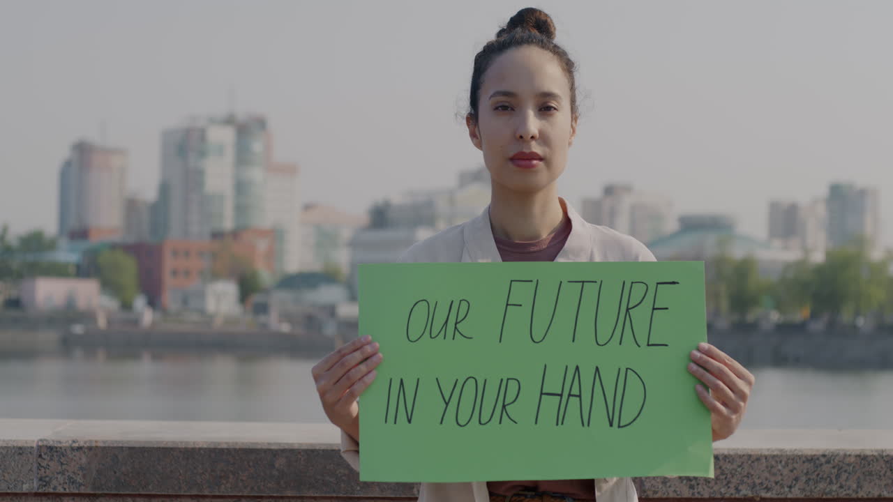 Woman Holding a Sign for a Better Future