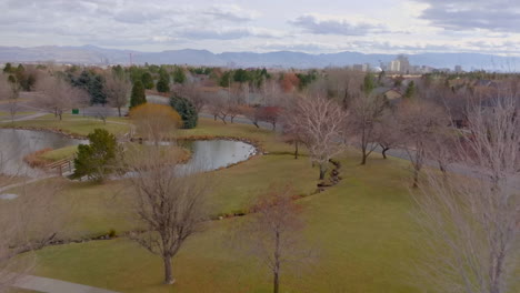 Aerial-of-a-suburban-park-in-Reno,-Nevada-on-a-pretty-winter-day-with-a-slow-pull-back