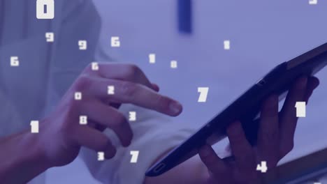 Multiple-numbers-changing-against-man-using-digital-tablet
