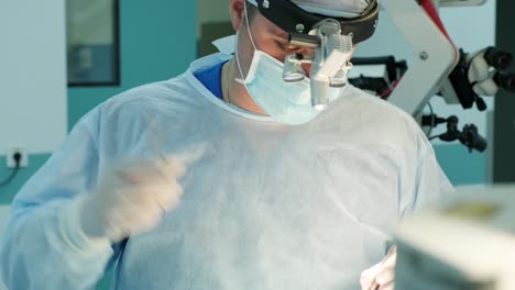 surgeon makes sutures the incision to the patient during surgery