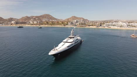 aerial: billionaire's luxury private superyacht moored off mexican coast