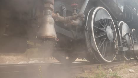 vintage railway locomotive venting and dripping steam and water