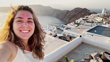 Woman's Santorini Sunset Selfie, Ocean and Village View