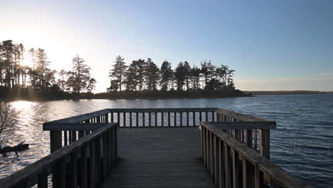 landscape with fishing pier at golden hour