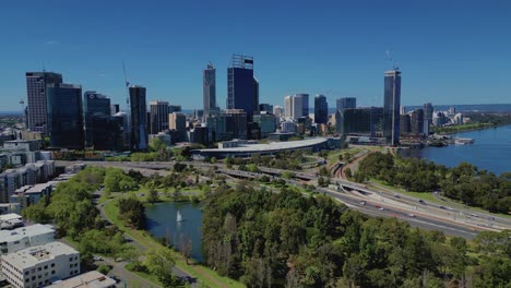 Perth-City-Skyline-with-Busy-Highway-Traffic-and-High-Downtown-District-Skyscrapers-Landscape---Aerial-Daytime-Panoramic-View