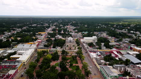 aerial backwards shot of main town of valladolid in yucatan mexico