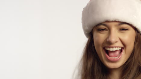 cu woman wearing santa hat dances