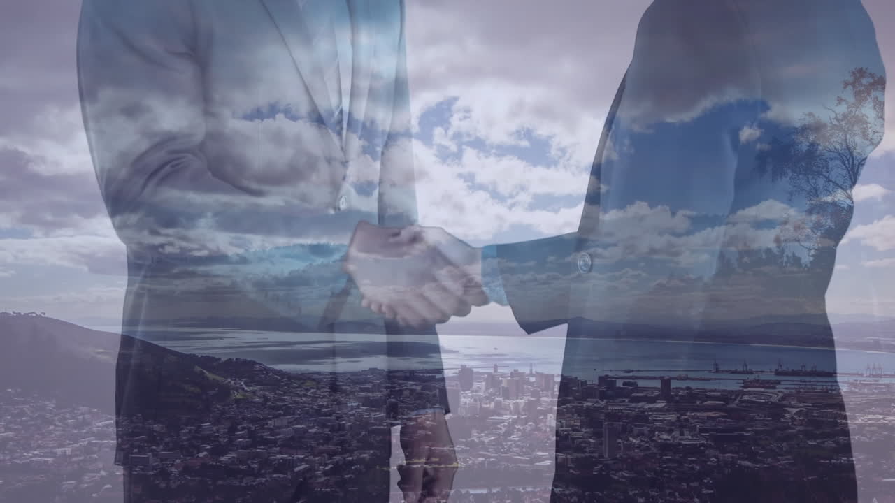 animación de un hombre de negocios apretando la mano sobre el paisaje