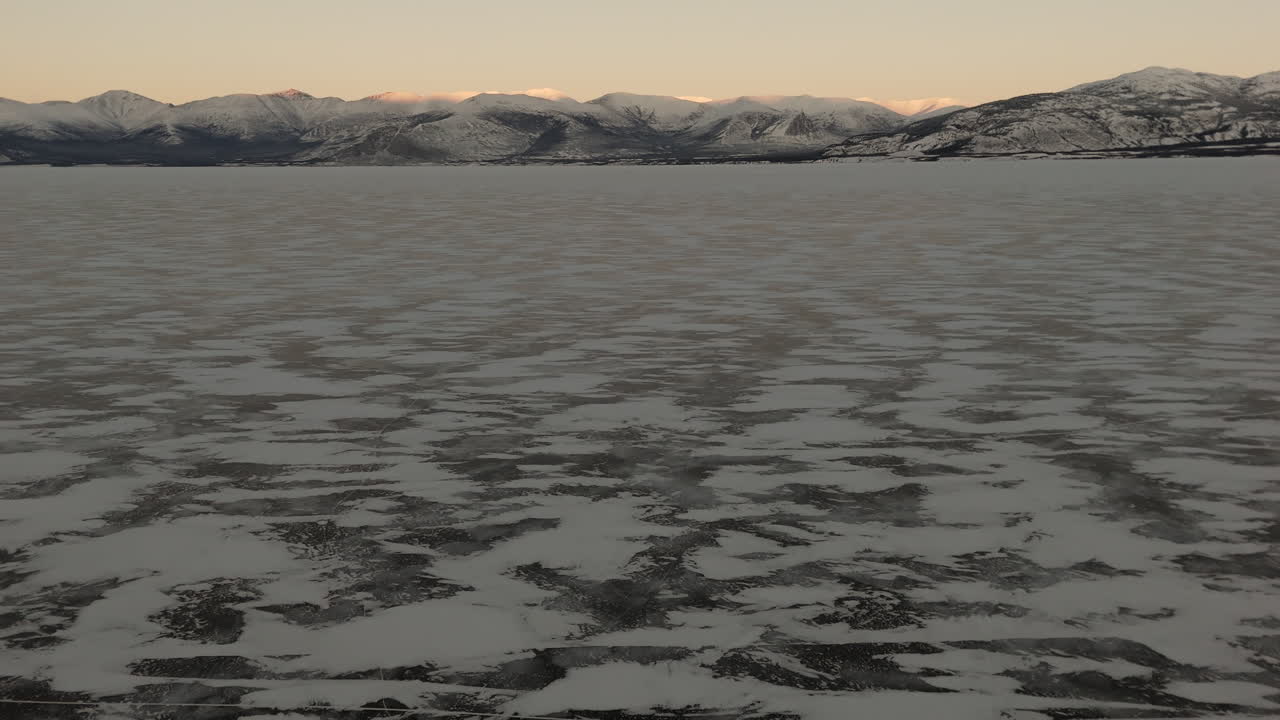 Winter Season Along Destruction Bay At Sunset In Kluane National Park, Yukon Canada. Aerial Drone Shot