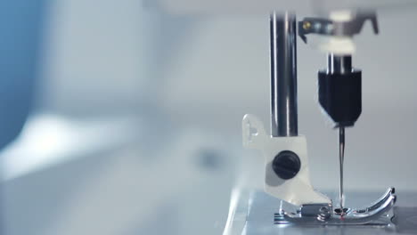 sewing needle of modern sewing machine. working electric sewing machine