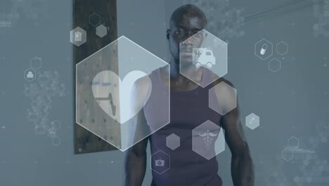 Animation-Von-Medizinischen-Und-Gesundheitlichen-Symbolen-über-Einem-Afroamerikanischen-Mann,-Der-Im-Fitnessstudio-Trainiert