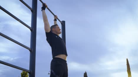Man-doing-abdominal-workout-at-the-pull-up-bar