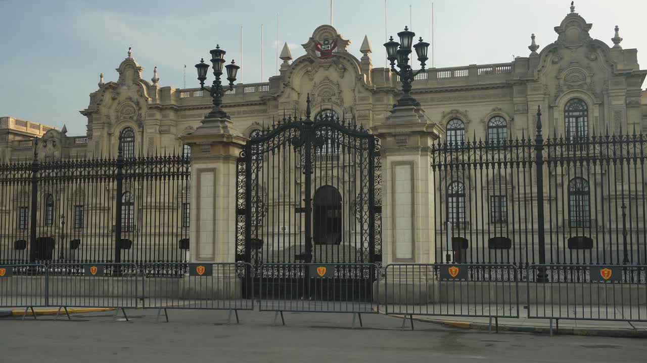 Close up shot of the Presidential Palace of Peru called "Palacio del Gobierno" with their main black gates locked. Recorded early in the morning. Located in "Plaza Mayor" in city center of Lima, Peru