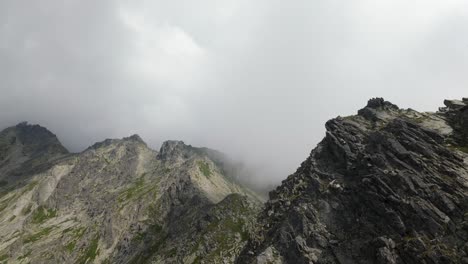 fpv drone footage of cloudy mountain scenery in the high tatras, slovakia