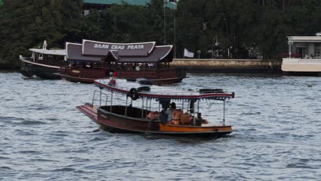 boats moving across rippling river waters