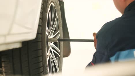 mechanic changing a tire