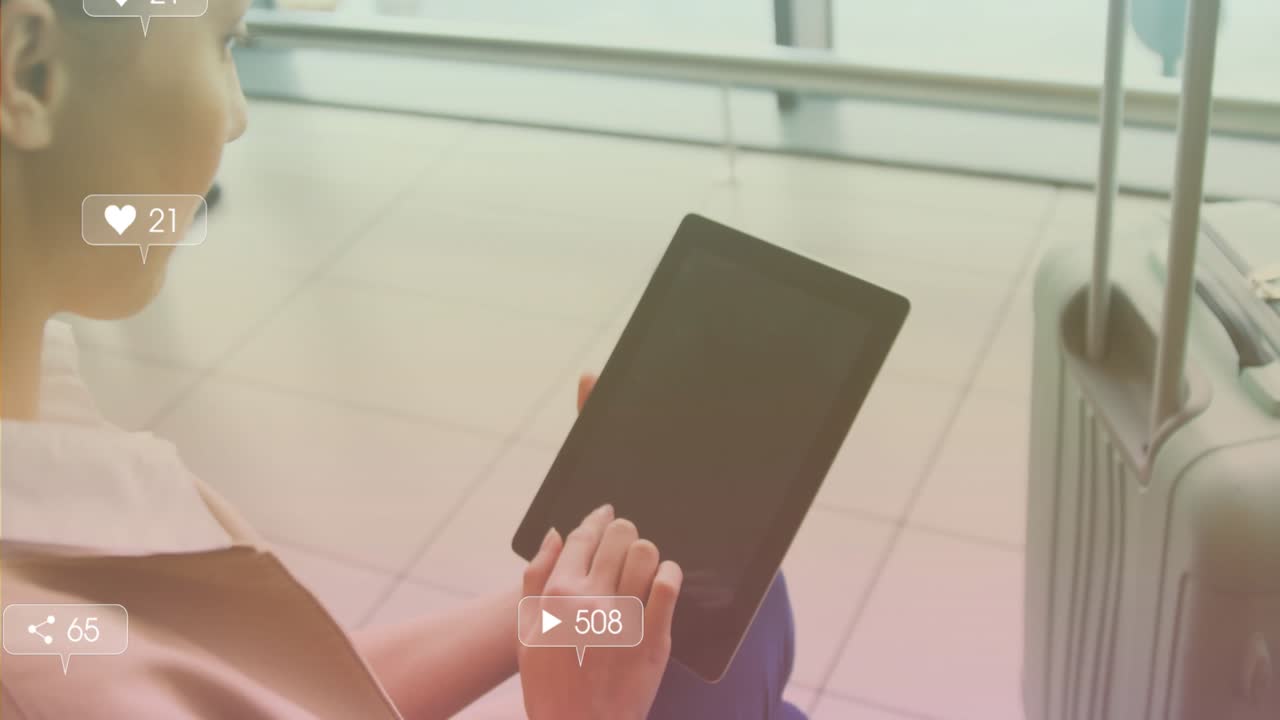 Woman transit lounge tapping tablet showing social media icons tracking engagement peaks and drops