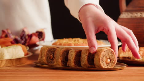 woman reaching for baklava