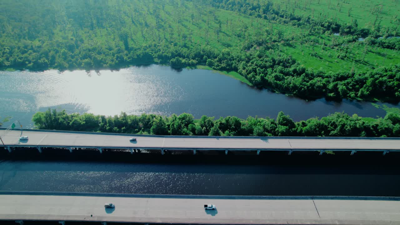 Reveal over the Maurepas Swamp—showcasing lush wetlands and reflective waterways for environmental and nature projects. I-55 Laplace, LA, USA
