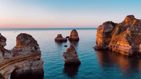 stunning aerial view of rocky coastline in portugal during sunset