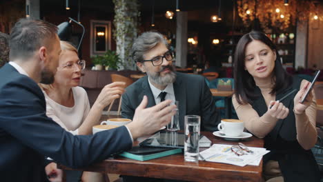 business people in a meeting at a coffee shop