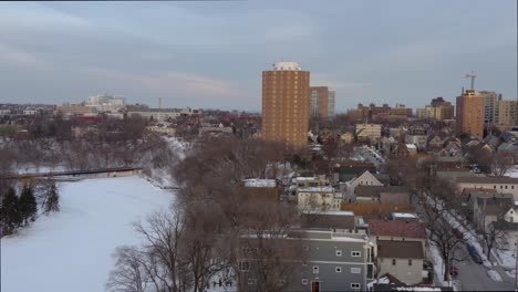 Aerial-View-of-Frozen-River-During-Winter-[4K