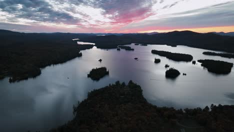 scenic view of forested lake islands during sunset in blue mountain lake, hamilton county, new york, usa