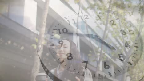 animation of moving clock and sea landscape over biracial woman using smartphone