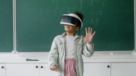 Little-girl-playing-with-VR-glasses.