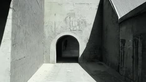 an arched stone doorway in a medieval castle