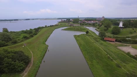 aerial shot of the historical town of veere, with an old windmill in frame