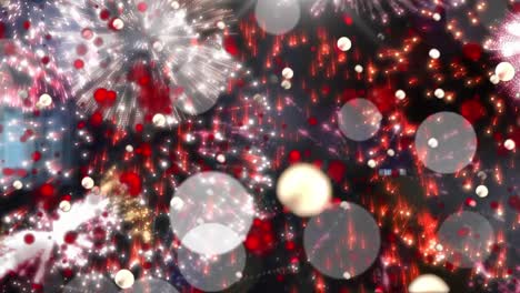 Animation-of-flashing-white-light-spots-moving-over-colourful,-sparkling-new-year-fireworks