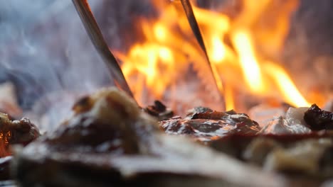 Extreme-Close-up-of-char-grilled-meat-on-a-BBQ