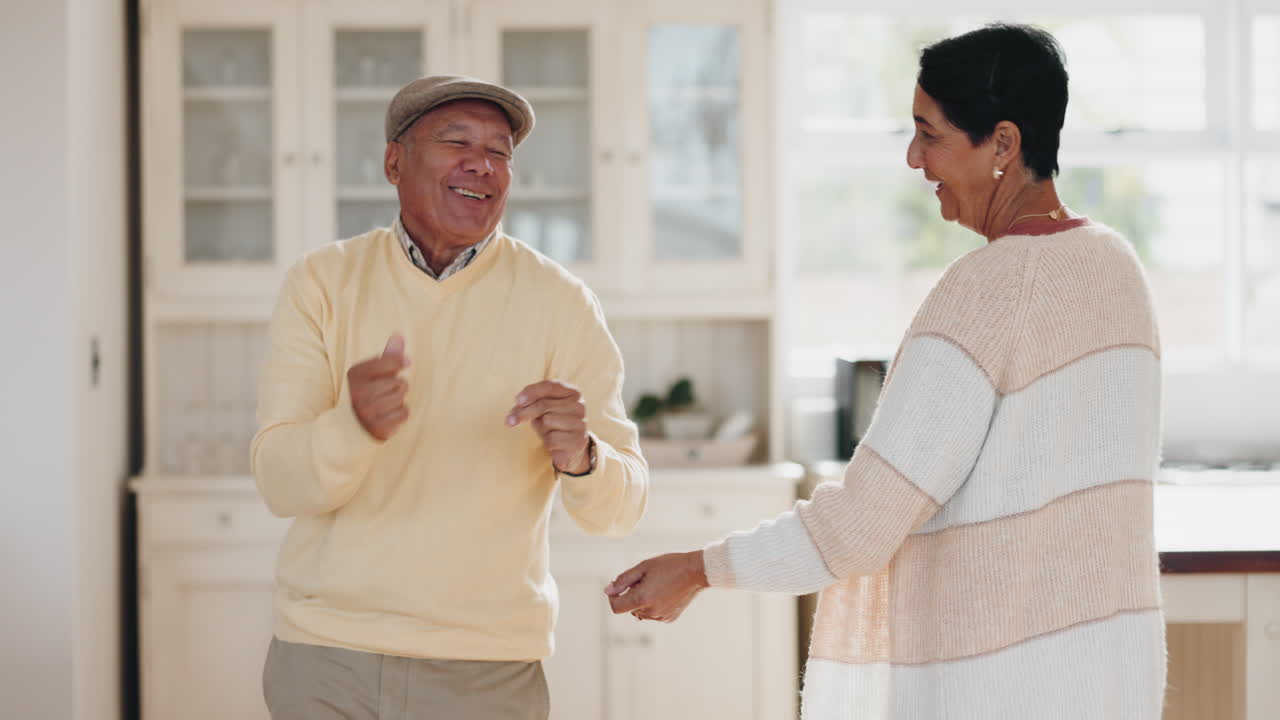 Love, home kitchen and happy elderly couple dance