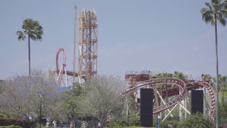 Epic-shot-of-a-ride-with-multiple-roller-coasters-twisting-and-turning-through-steel-track