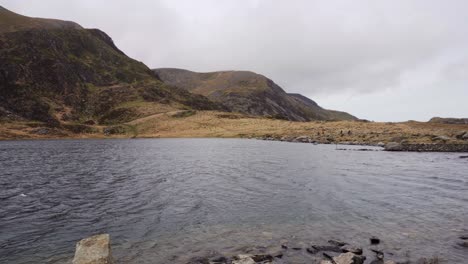 panning over llyn idwal, beautiful lake in snowdonia national park, north wales on a very windy day