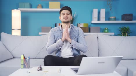 happy young man praying, finding peace.